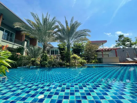 Shared swimming pool outside Deluxe rooms