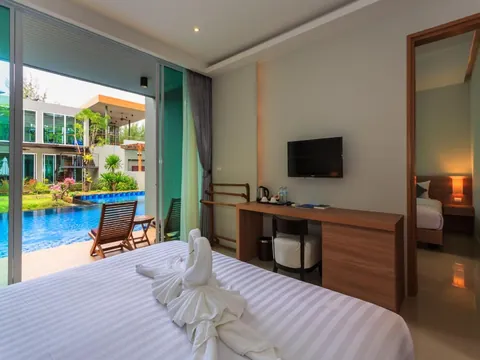 Deluxe bedroom opening to the pool terrace