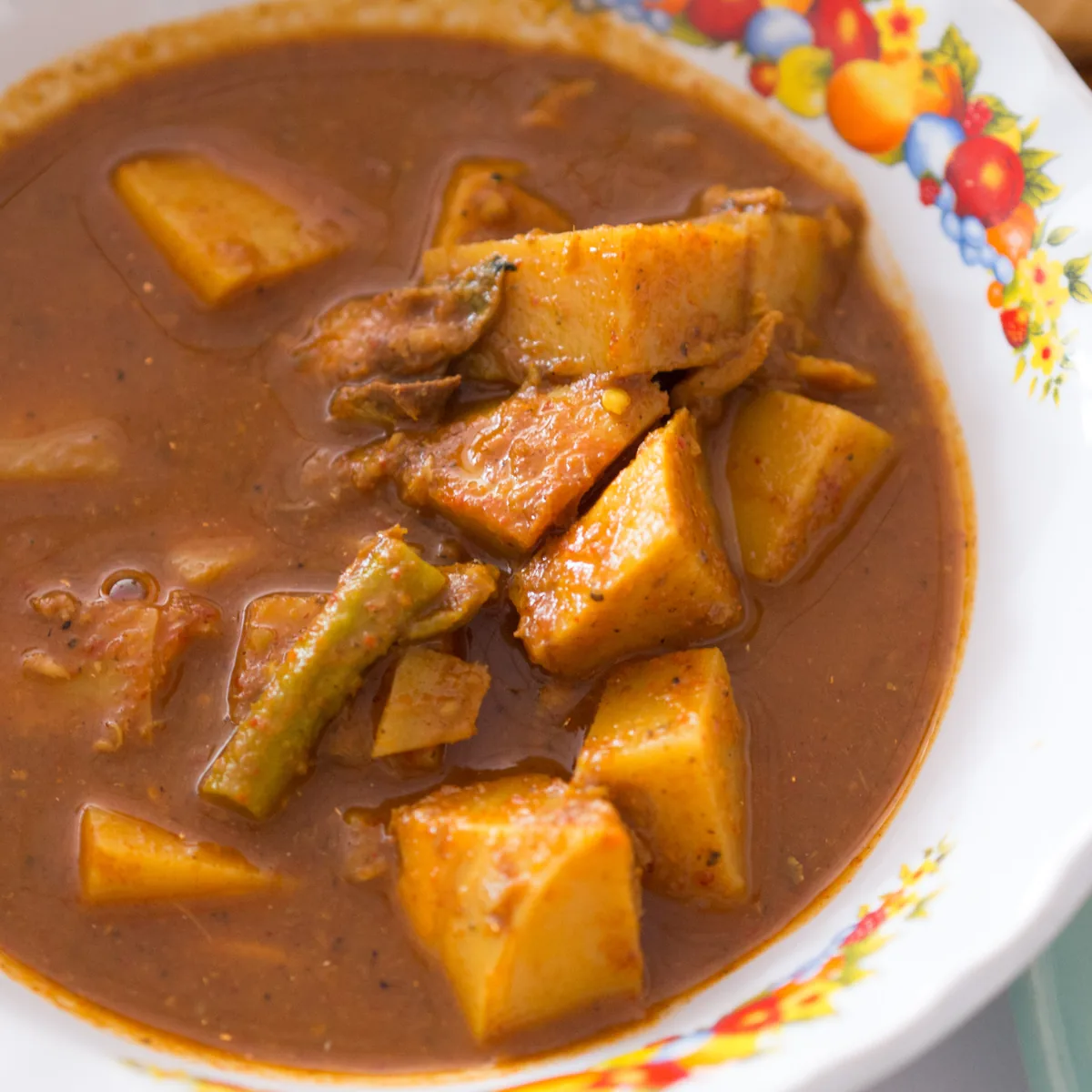 Kaeng tai pla curry with bamboo shoots and long beans in a patterned bowl