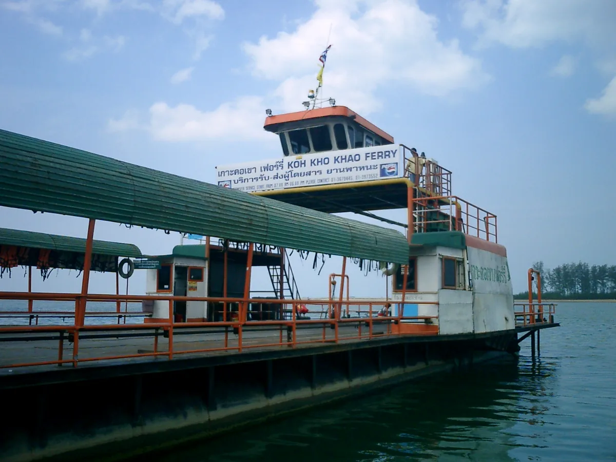 The signed Ko Kho Khao ferry moored beside the water