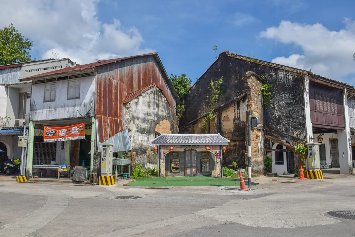 Historic shophouses beside a quiet street in Takua Pa Old Town