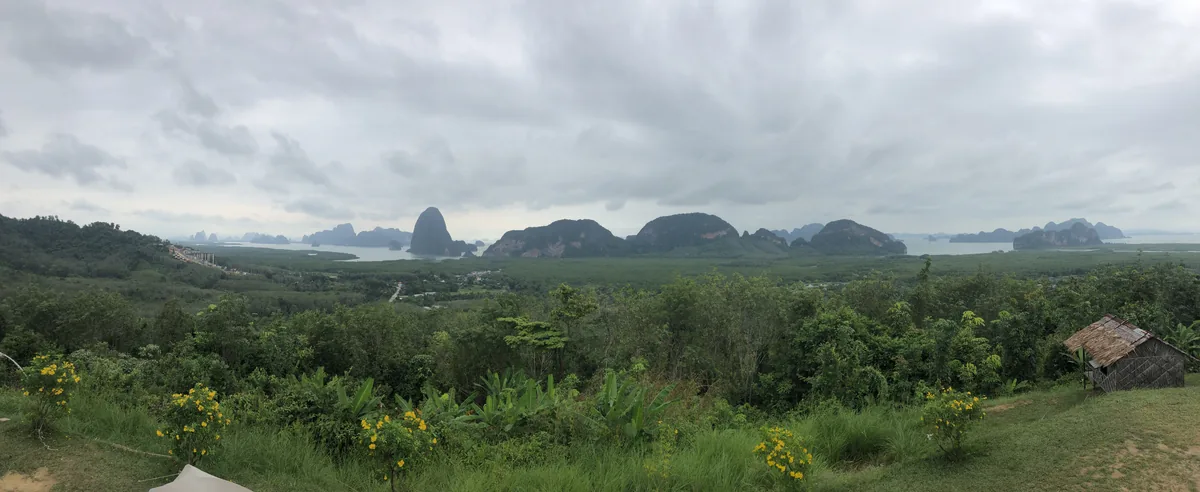 A wide panorama of mangroves, water and limestone hills from Ao Tho Li Viewpoint